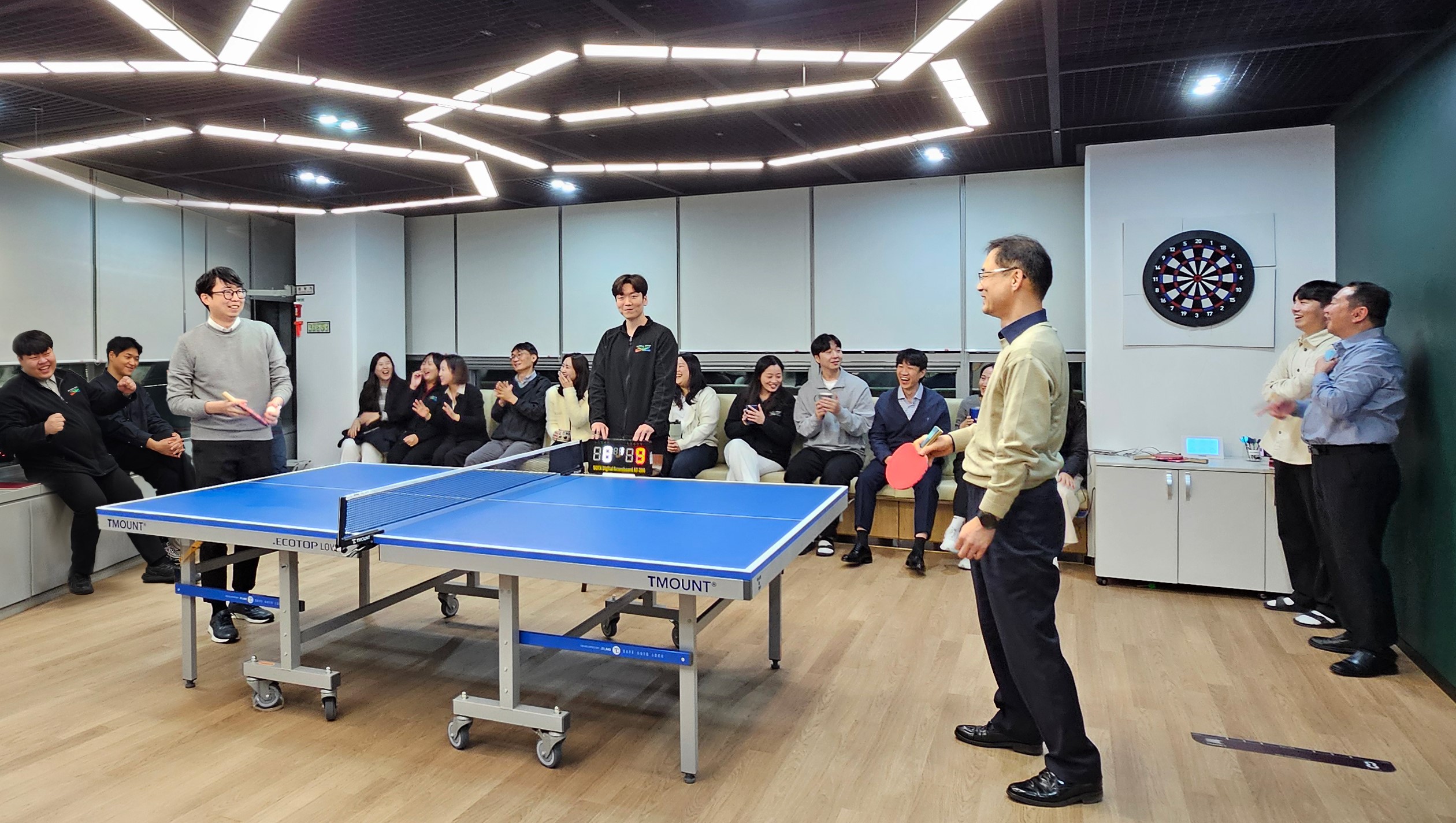 Members of UDC Korea playing table tennis.